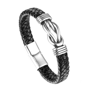 Men's black braided leather bracelet featuring a silver metal knot and magnetic clasp