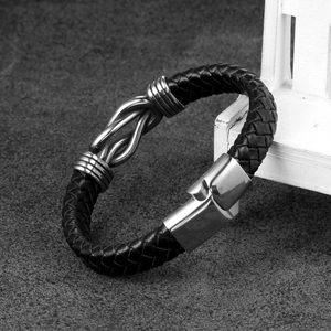 Men's braided black leather bracelet with interlocking stainless steel rings and magnetic clasp