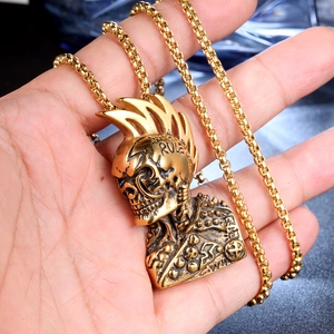 Punk style golden skull pendant with mohawk and biker jacket on chunky metal chain