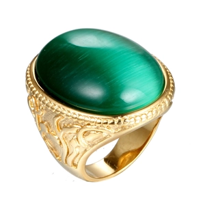 Vintage gold titanium steel ring with a large green oval cat's eye gemstone