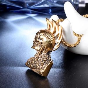 Detail of golden skull helmet pendant with Ghetto Rules engraving on beaded chain