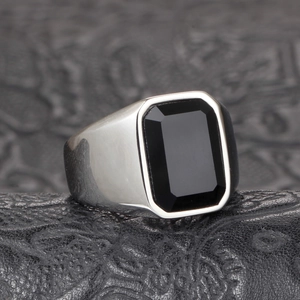 Men's polished steel ring featuring a bold square black onyx gemstone on leather