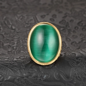 Men's vintage 18k gold plated ring with a green cat-eye stone and woven metal details
