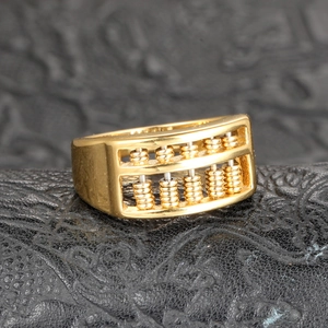 Golden titanium steel spinning abacus ring for men with movable beads and traditional design