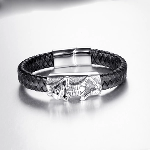 Black braided leather bracelet with a silver skull motif and magnetic clasp closure