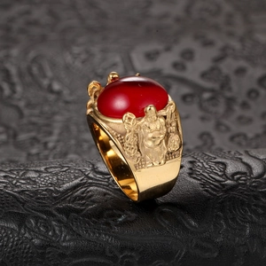 Vintage men's titanium steel ring with large red gemstone and gold relief carvings