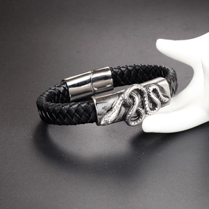 Vintage punk braided leather snake bracelet with a silver magnetic clasp on a white model