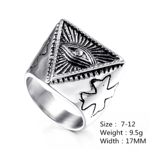 Macro shot of silver gothic evil eye ring with intricate engraved side patterns