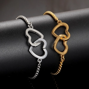 Elegant intertwined gold and silver heart bracelets with adjustable bead chain for women