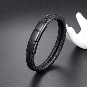 Macro shot of double-strand black braided leather bracelet with matte black magnetic clasp