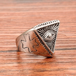 Macro detail of vintage stainless steel ring with engraved Eye of Providence symbol