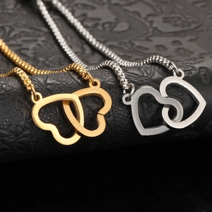 Minimalist double interlocking heart chain bracelet in gold and silver stainless steel