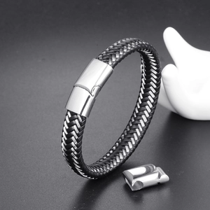 Macro shot of adjustable braided leather cord bracelet with stainless steel magnetic clasp