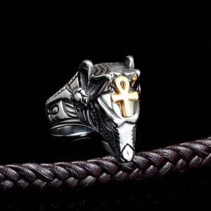 Detailed relief of Anubis punk ring with golden Ankh symbol on black background
