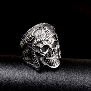 Punk skull stainless steel ring featuring vintage aviator goggles on a black display