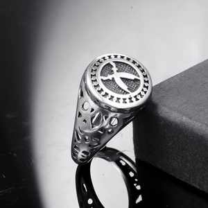 Vintage stainless steel signet ring for men featuring a bird emblem and hollow carving