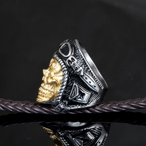 Close-up of a vintage biker ring featuring a pilot skull with goggles in gold and silver