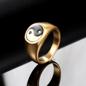 Gold stainless steel men's ring with classic Yin Yang Tai Chi symbol on black surface