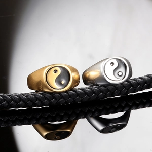 Polished stainless steel tai chi rings in gold and silver with ying yang sign design