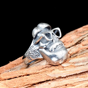 Retro punk skull ring for men with glasses design and antique silver finish on wood