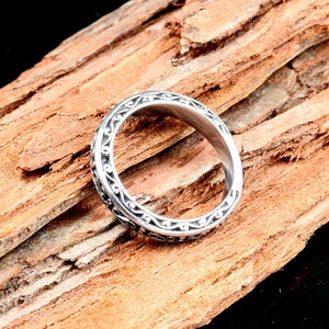 Classic silver titanium steel S-shape ring with vintage floral relief on tree bark