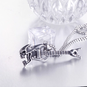 Rock guitar necklace with skull pendant and rock-on gesture in silver stainless steel