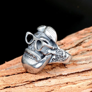 Vintage punk skull ring for men featuring detailed sunglasses and beard on rustic wood