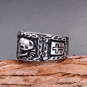 Detail view of gothic skull ring with cross engraving on vintage silver stainless steel