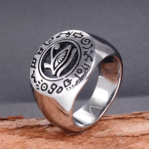 Titanium steel ring for men featuring an Eye of Horus relief on a tree bark setting
