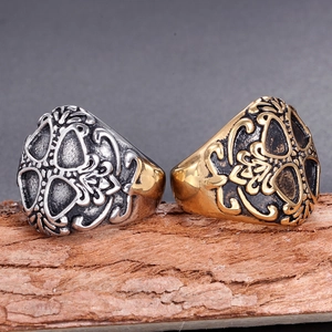 Vintage stainless steel skull rings with intricate cutout patterns in gold and silver finish