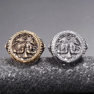 Vintage Liberty 1913 coin rings in gold and silver finish on a display stand