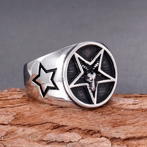 Macro view of vintage stainless steel signet ring with Baphomet pentagram engraving