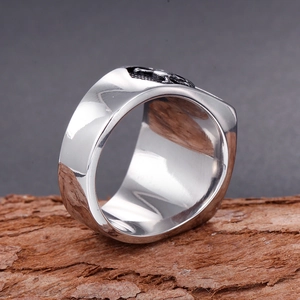 Vintage silver Masonic stainless steel signet ring for men on rustic bark background