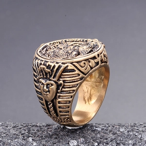 Macro side view of vintage bronze Egyptian Pharaoh signet ring with detailed relief