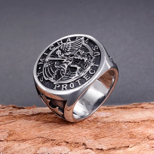 Macro detail of St. Michael relief and Saint Michael Protect Us engraving on men's ring