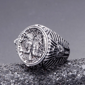 Macro detail of vintage stainless steel ring with Aztec relief and skull motif