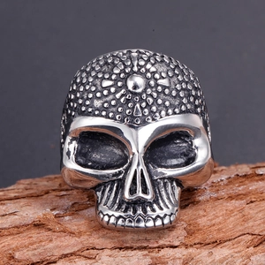 Gothic punk skull ring for men in vintage silver cast stainless steel on wood
