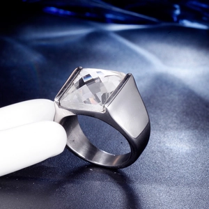 Macro detail of men's stainless steel ring featuring a square-cut white zircon stone