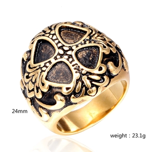 Detail view of gothic skull ring in gold finish showing 24mm width and 23.1g weight