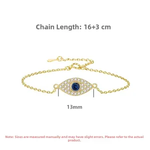 Detail view of gold Evil Eye bracelet featuring blue zircon and sparkling crystals