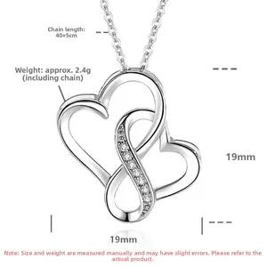 Macro detail of S925 sterling silver double interlocking heart pendant with pavé crystals