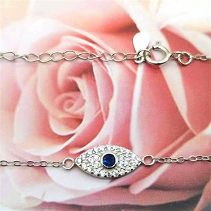 Sterling silver evil eye bracelet with blue gemstone and sparkling zircon accents