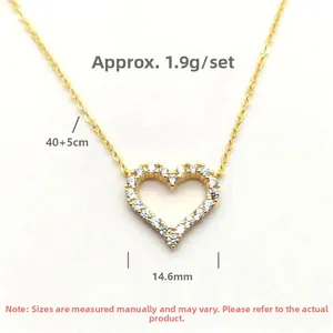 Detailed view of hollow heart pendant necklace with cubic zirconia on fine chain