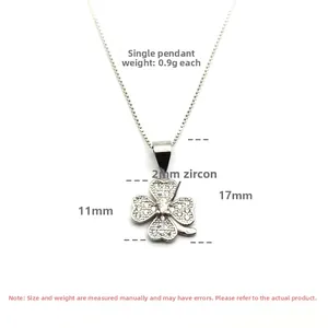 Detailed view of silver clover pendant with 2mm zircons and 17mm total height
