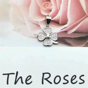 Detailed macro of S925 sterling silver four-leaf clover pendant with sparkling zircons