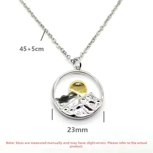 Detail of round mountain pendant with gold sun, measuring 23mm diameter and 45cm chain