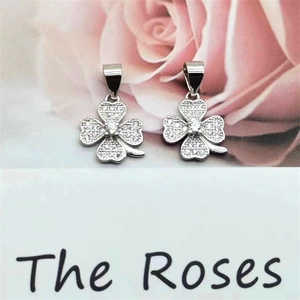 Detail of S925 sterling silver four-leaf clover pendant with white zircon stones