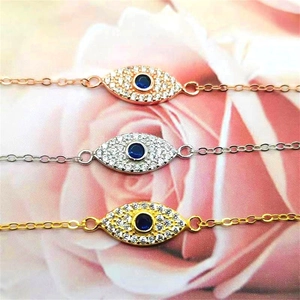 Detailed view of S925 sterling silver evil eye bracelets in gold, silver and rose gold