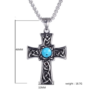 Detail shot of Celtic cross pendant with blue stone showing 46mm height and 32mm width