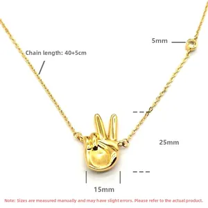 Macro view of gold-plated peace gesture pendant with 40+5cm chain dimensions